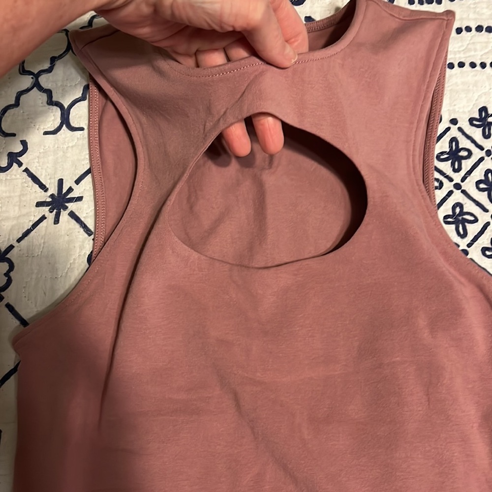Express blush pink tank with oval keyhole on front